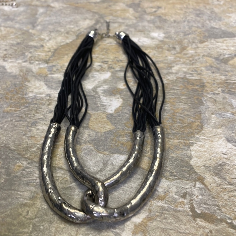 Interesting metal intertwined necklace